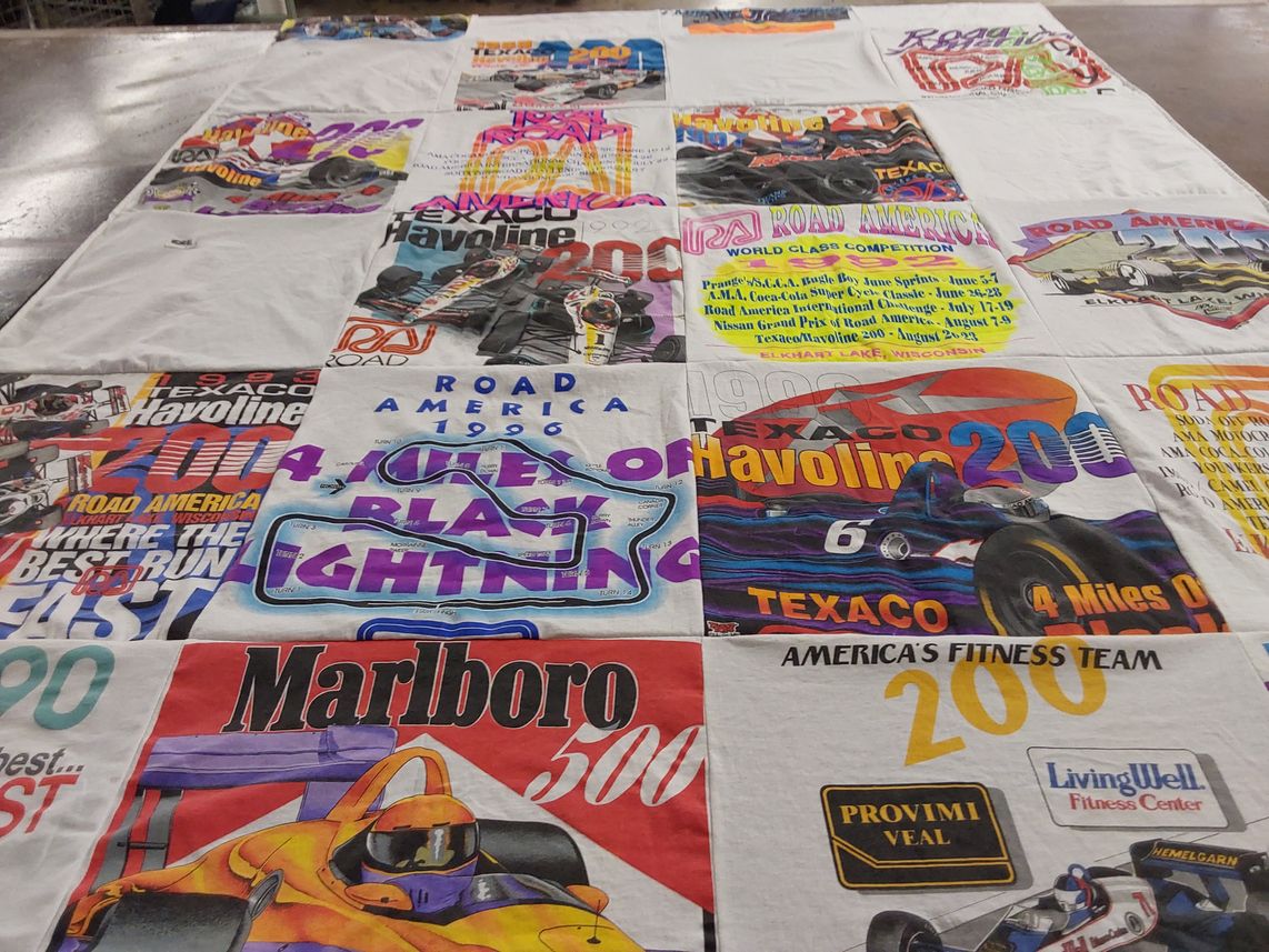 T-shirt quilt with motor racing, fitness themes by Kathy from ND