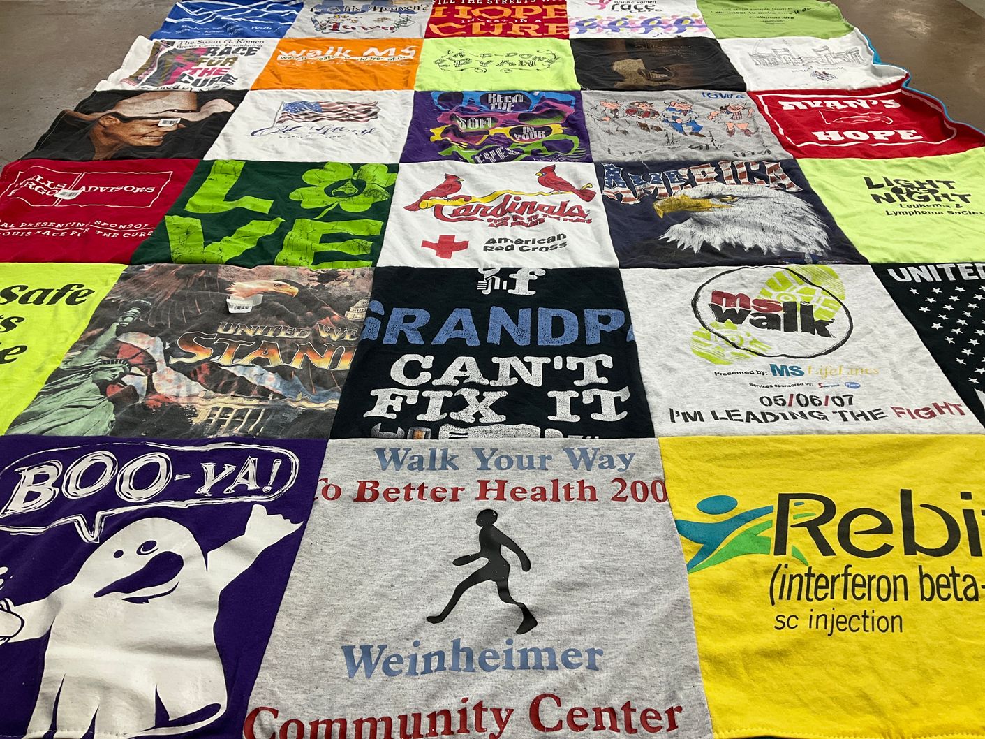 T-shirt quilt with health, community themes by Joan from IL