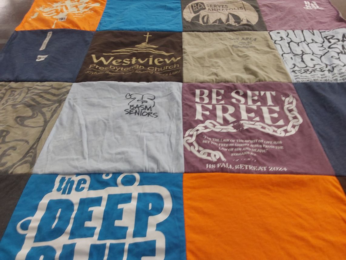 T-shirt quilt with religion, community themes by Julia from MD