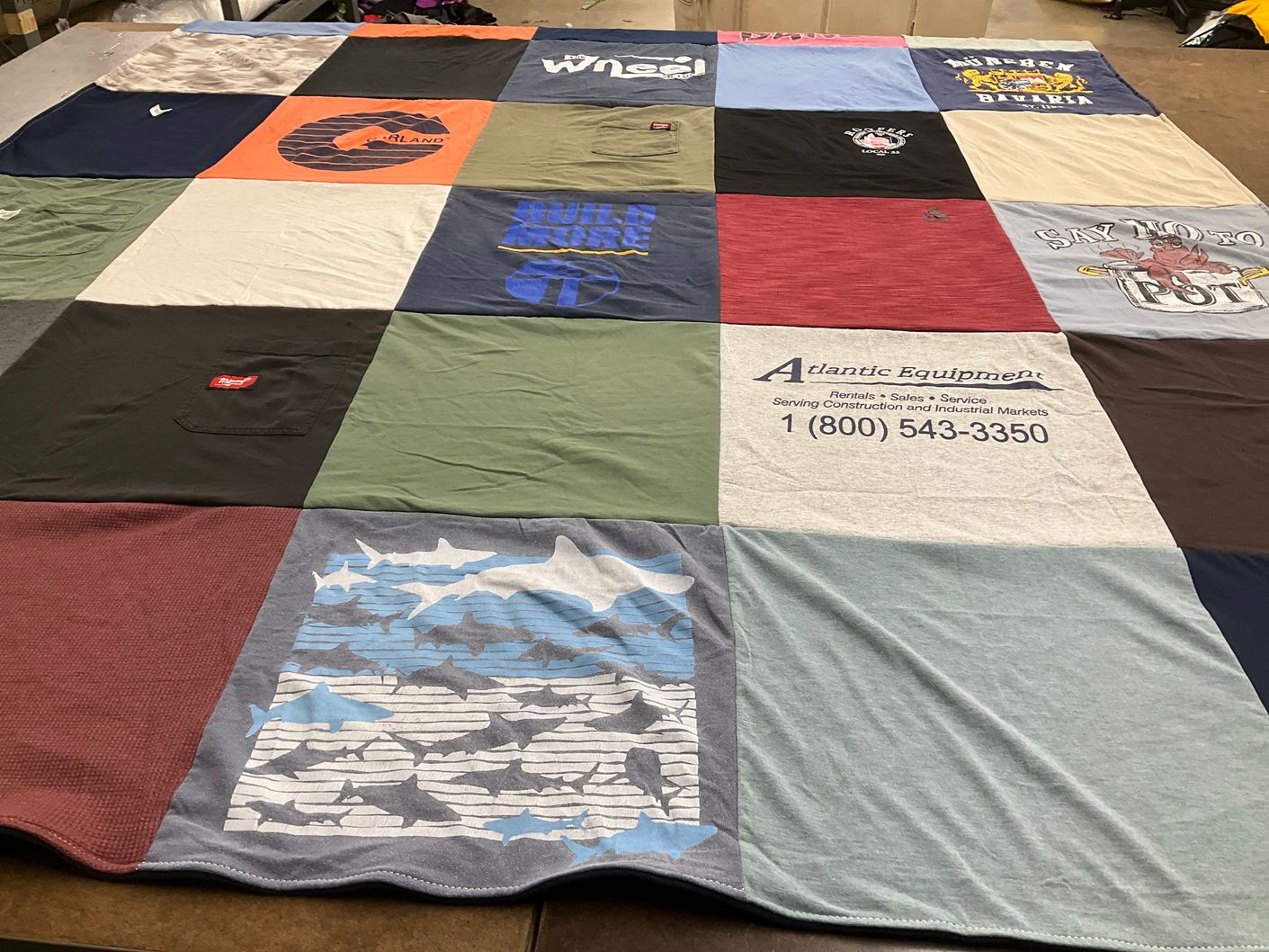 T-shirt quilt with construction, equipment themes by Madison from MA