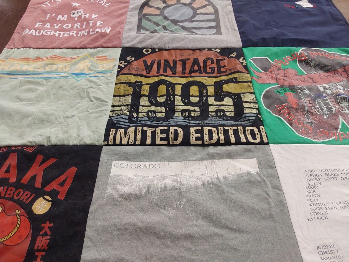 T-shirt quilt with family, travel themes by Tyler from CA