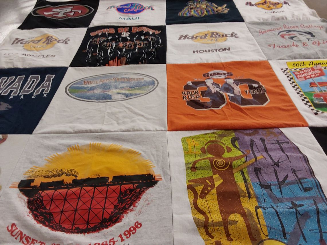 T-shirt quilt with travel, music themes by John from CA