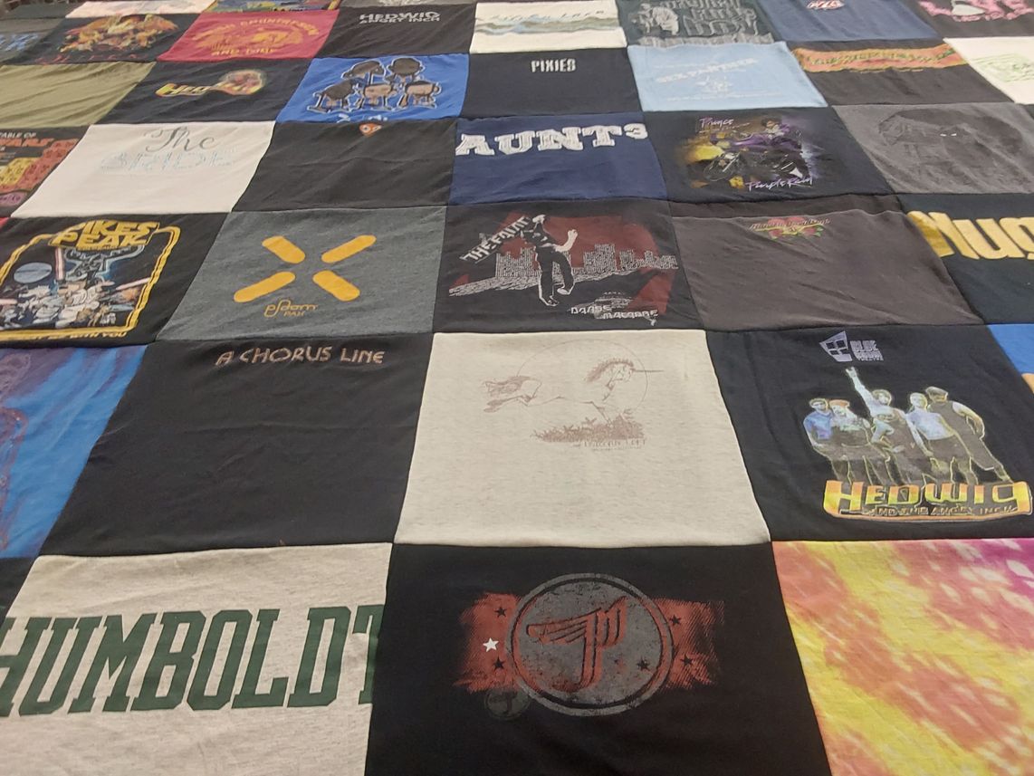 T-shirt quilt with theater, music themes by Alicia from CA