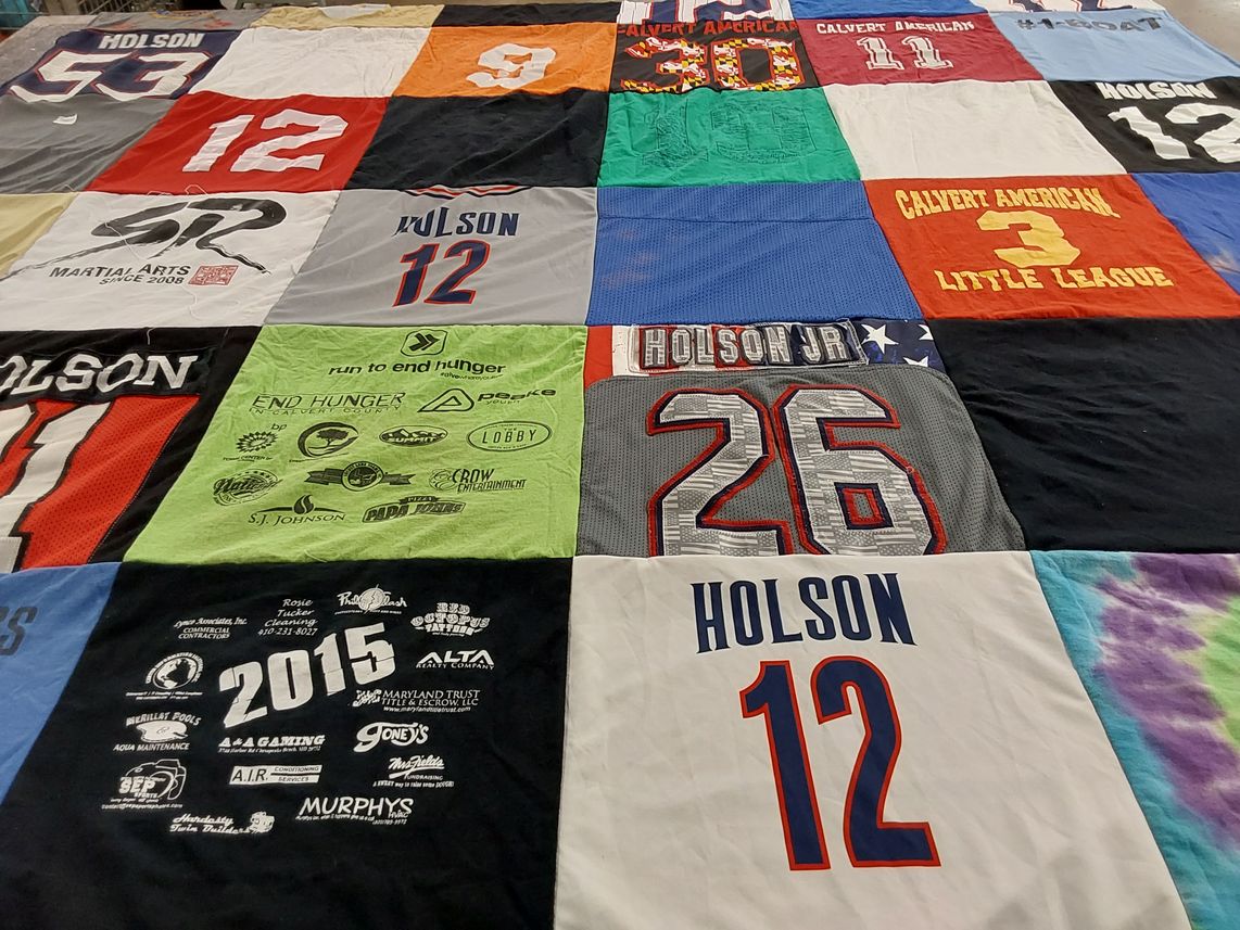 T-shirt quilt with sports, community service themes by Amber from MD