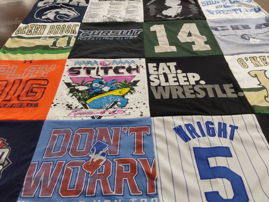 T-shirt quilt with wrestling themes by pamela from NJ