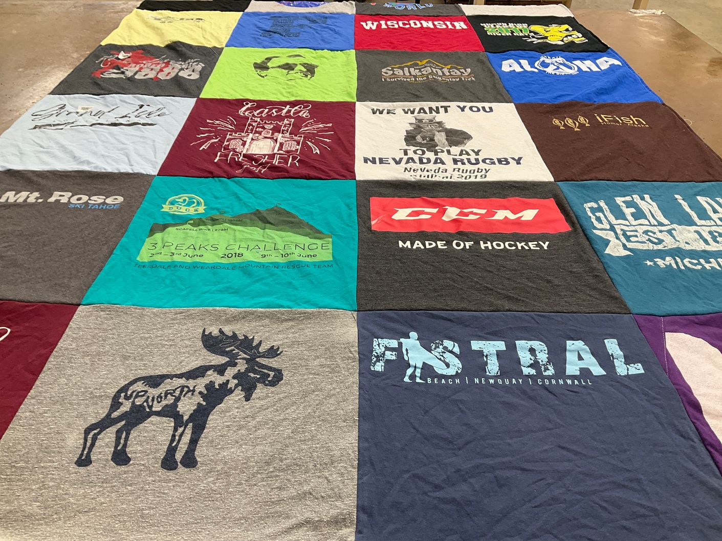 T-shirt quilt with rugby, surfing themes by Olivia from NV