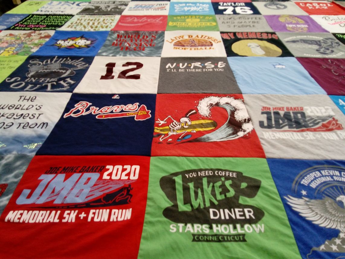 T-shirt quilt with running, softball themes by Carol from NC