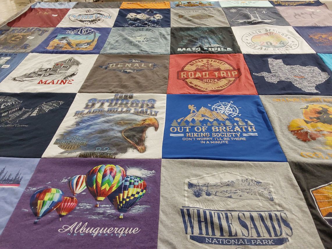 T-shirt quilt with hiking, traveling themes by Matthew from CO