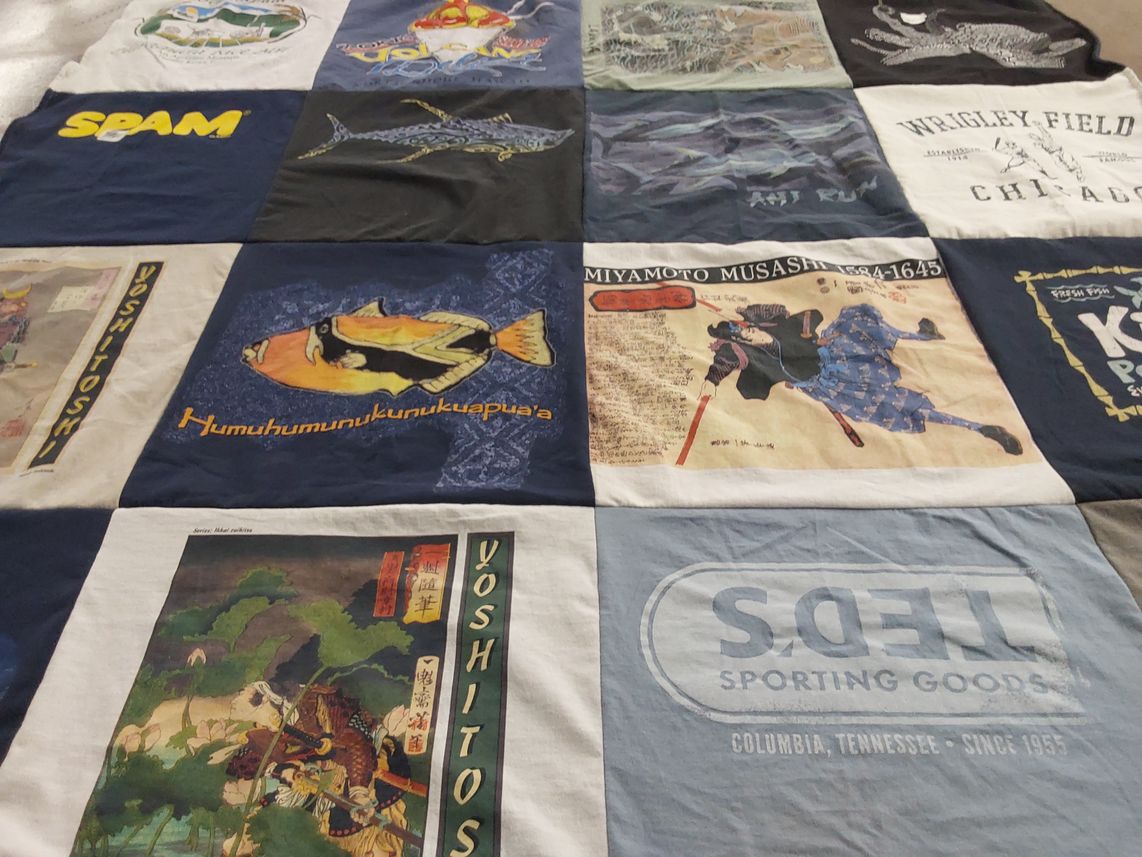 T-shirt quilt with fishing, martial arts themes by Coleen from TN