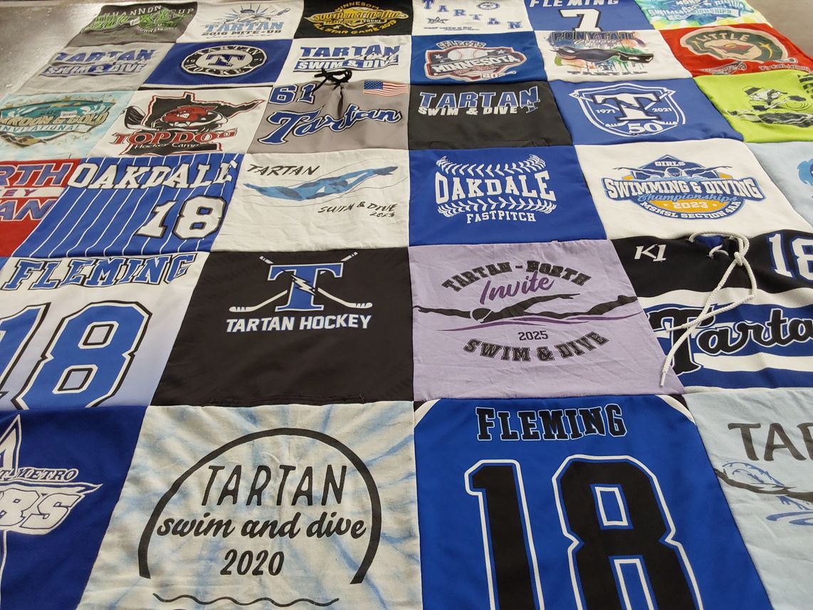 T-shirt quilt featuring tartan swim and dive, tartan hockey by Ellen from MN