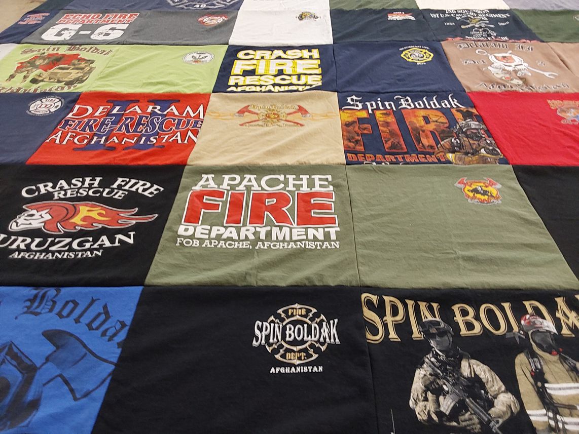 T-shirt quilt with firefighting, military themes by Monna from NC