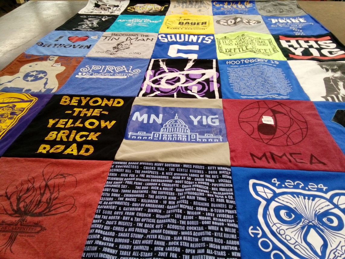 T-shirt quilt with music, theater themes by Anna from MN