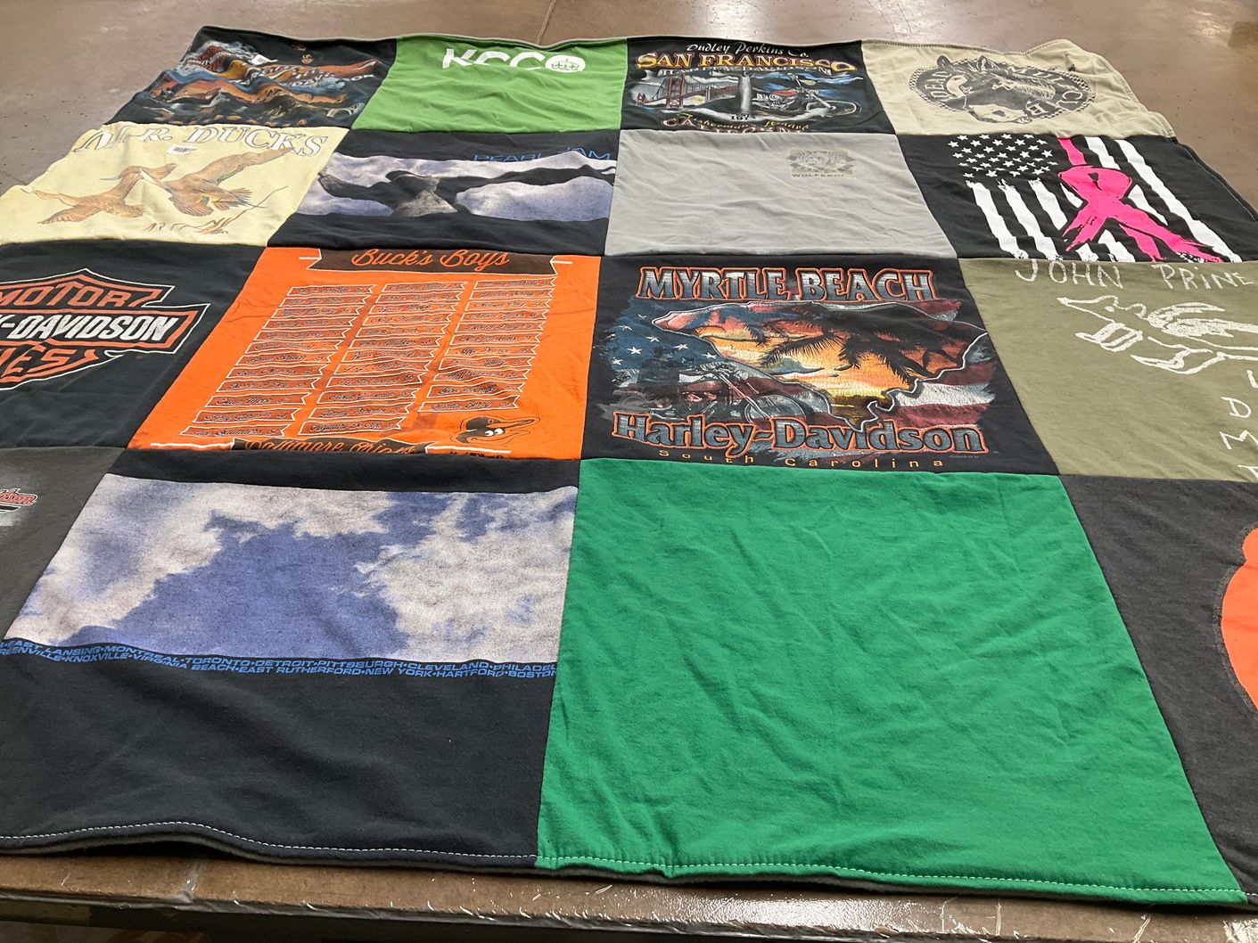 T-shirt quilt with motorcycling, fishing themes by Mary from MD