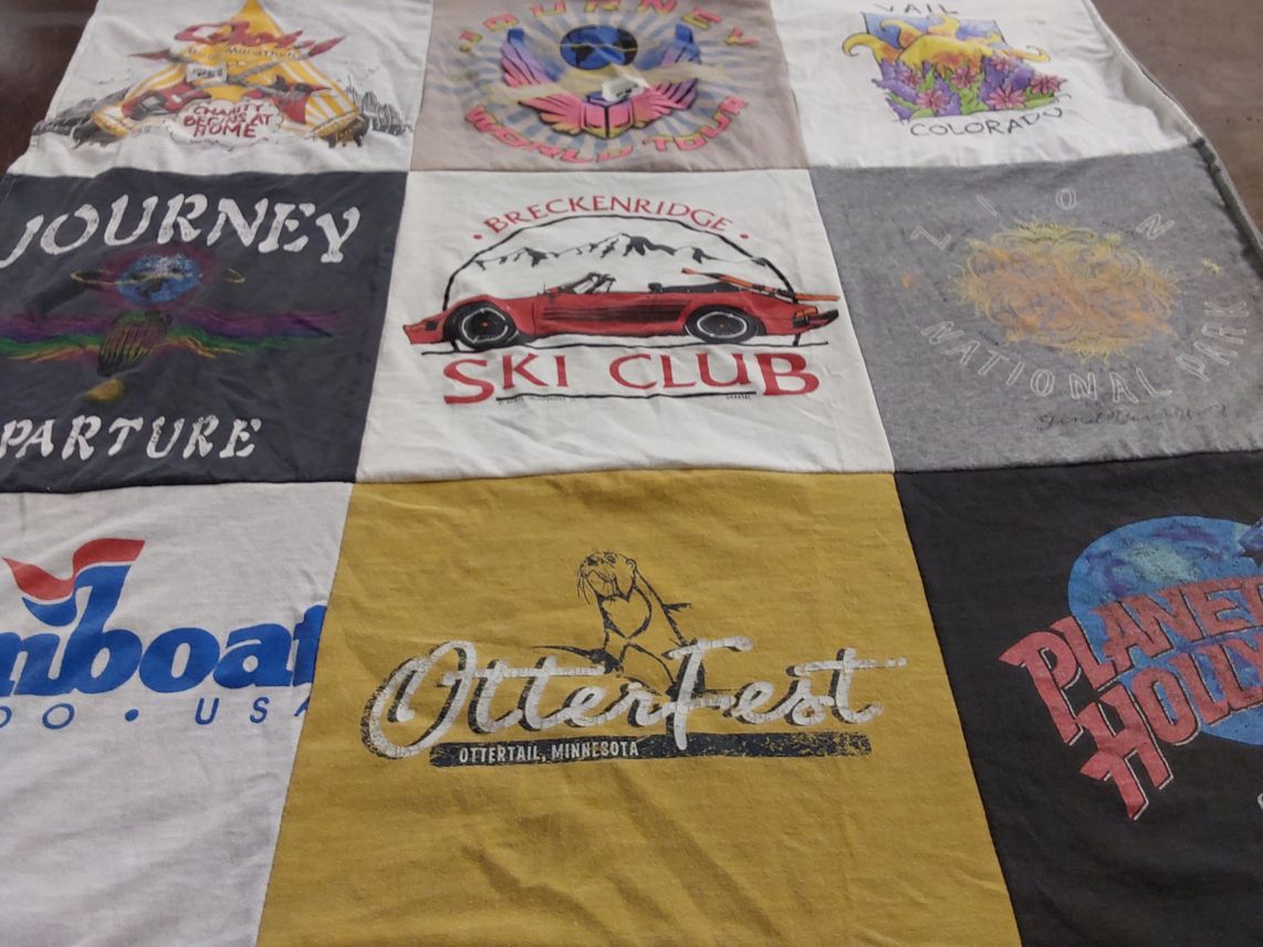 T-shirt quilt with skiing, travelling themes by Lois from NJ