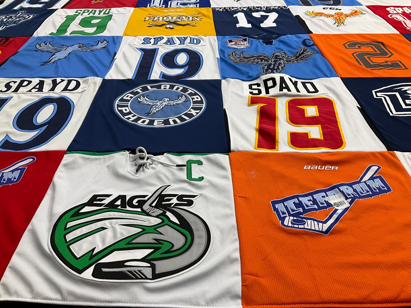 T-shirt quilt with hockey themes by Julie from GA
