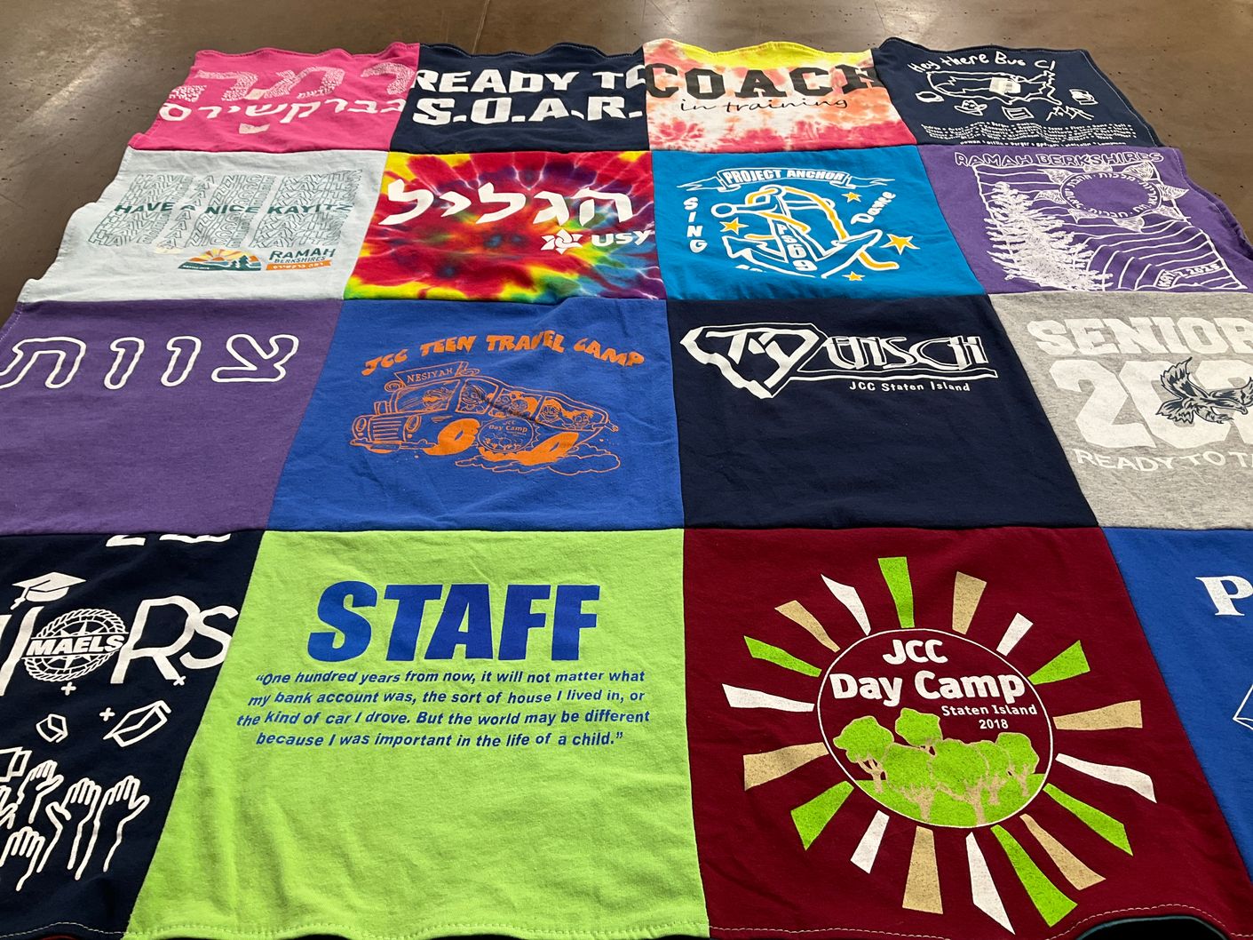 T-shirt quilt with camping, education themes by Seva from NY