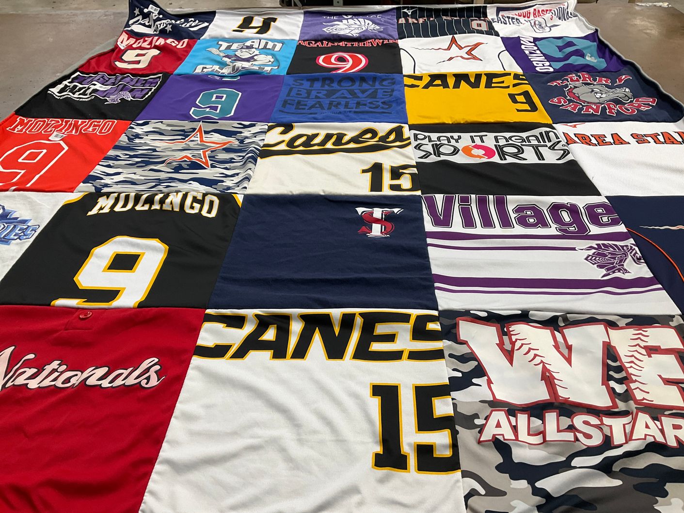 T-shirt quilt with sports themes by Tracy from NC
