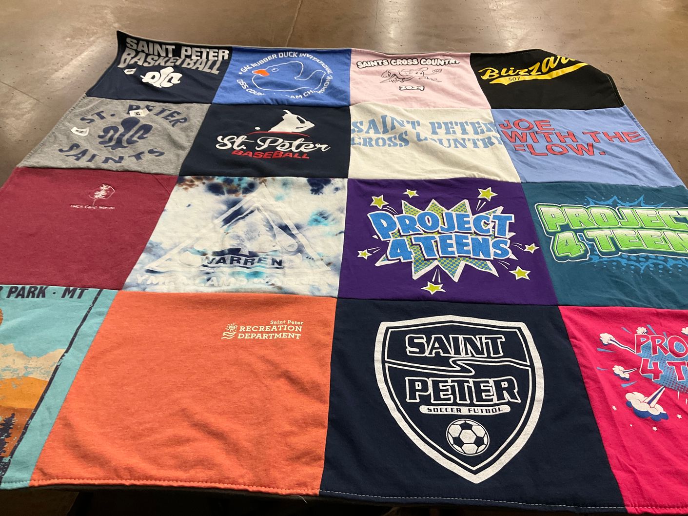 T-shirt quilt featuring saint peter saints basketball, saint peter cross country by Kenneth from MN