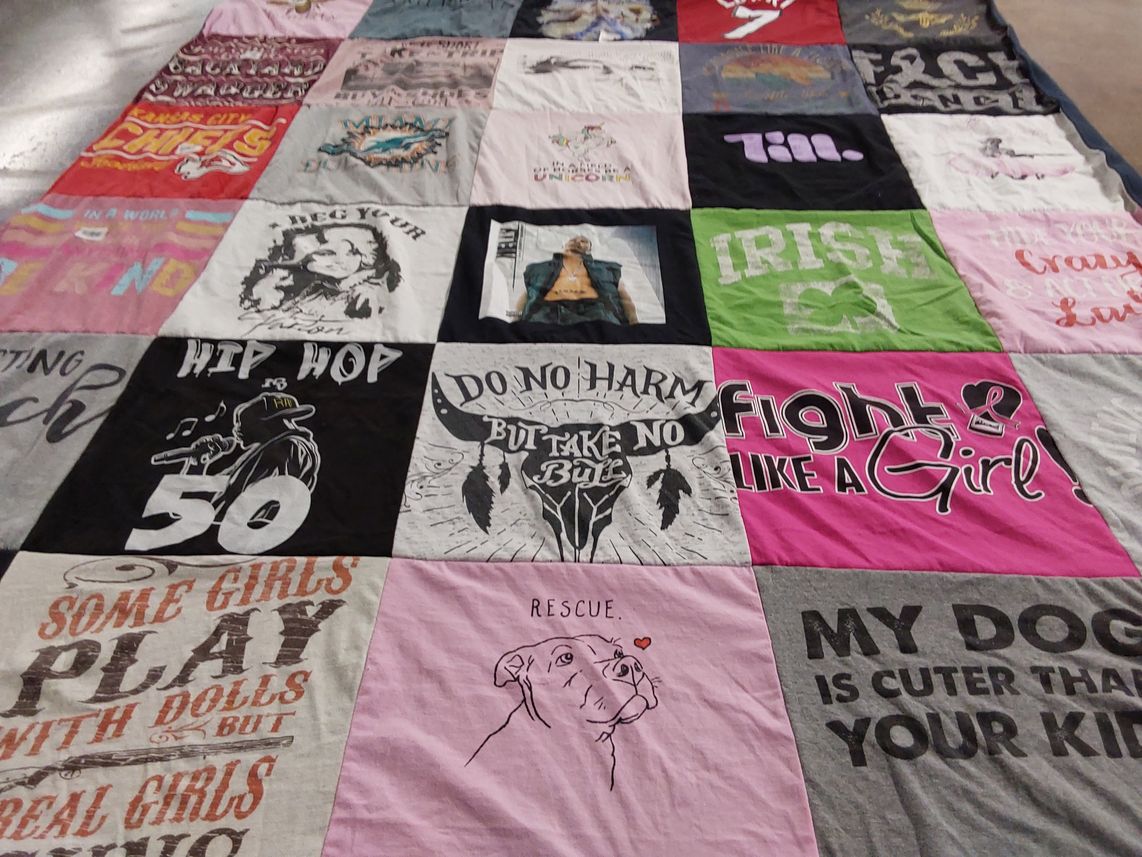 T-shirt quilt with animal rescue, feminism themes by Bridget from FL
