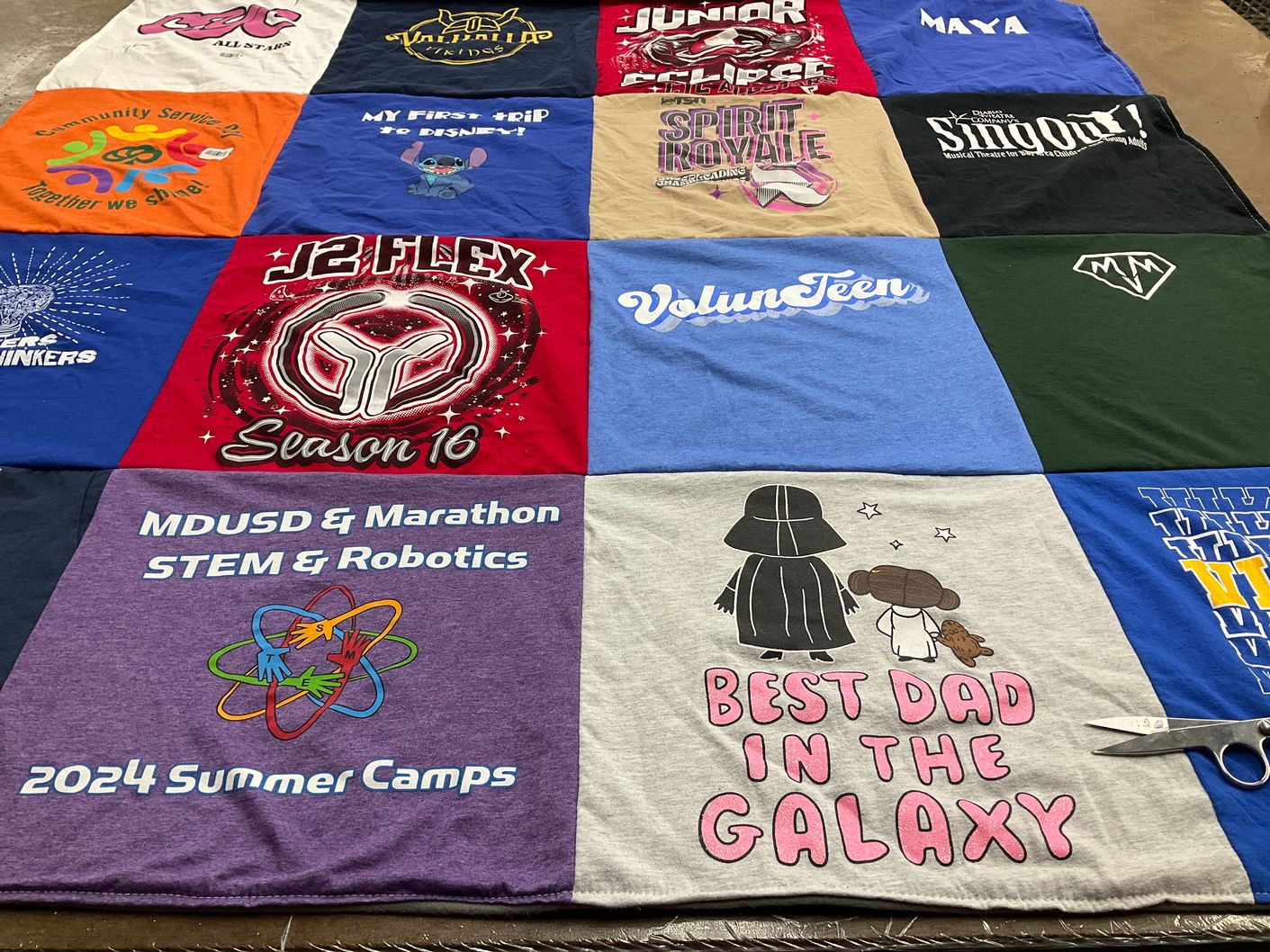 T-shirt quilt with community service, robotics themes by Christine from CA