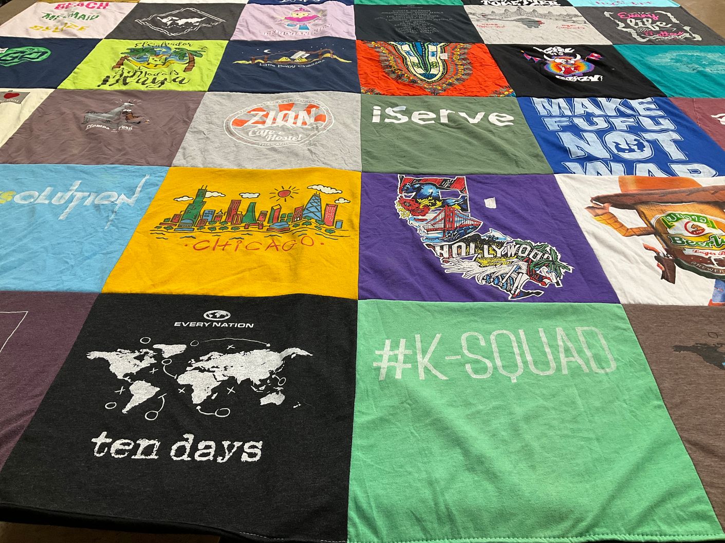 T-shirt quilt with travel, community themes by Kelsey from SC