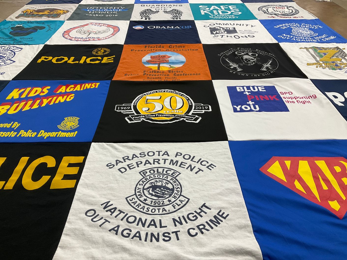 T-shirt quilt with community service, crime prevention themes by Eric from FL