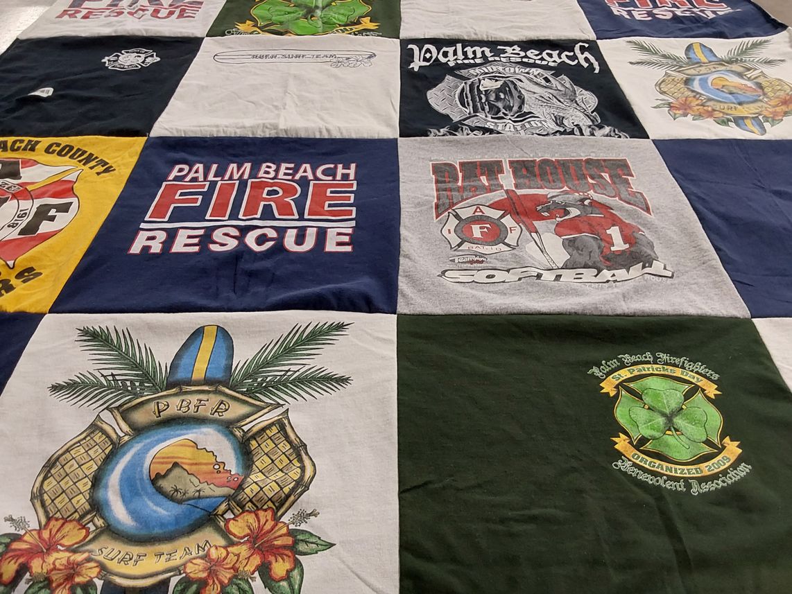 T-shirt quilt with firefighting, surfing themes by karyn from FL