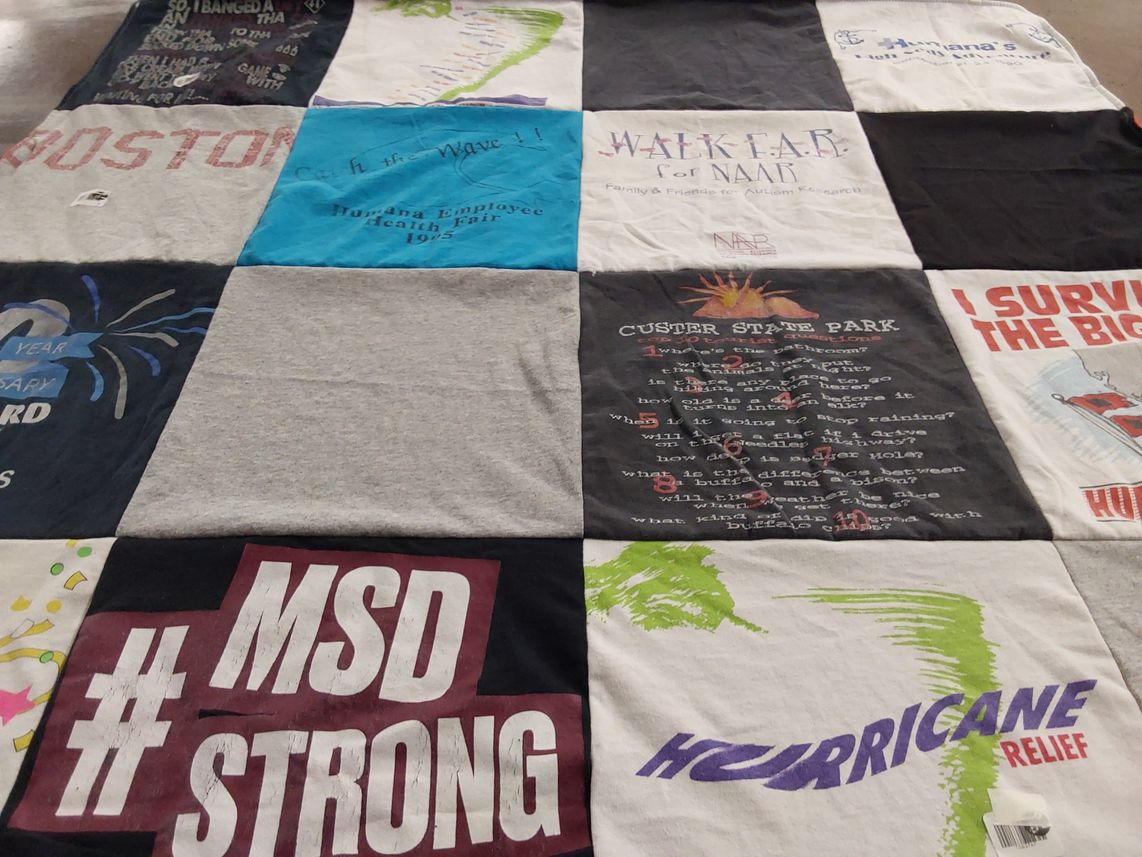 T-shirt quilt with autism awareness, hurricane relief themes by Debra from FL