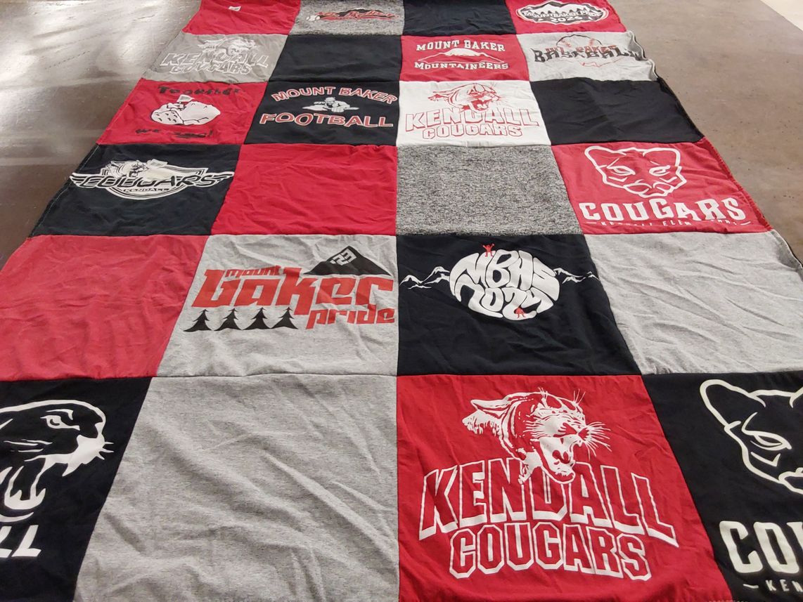 T-shirt quilt featuring mount baker mountaineers, kendall cougars by Lindy from WA