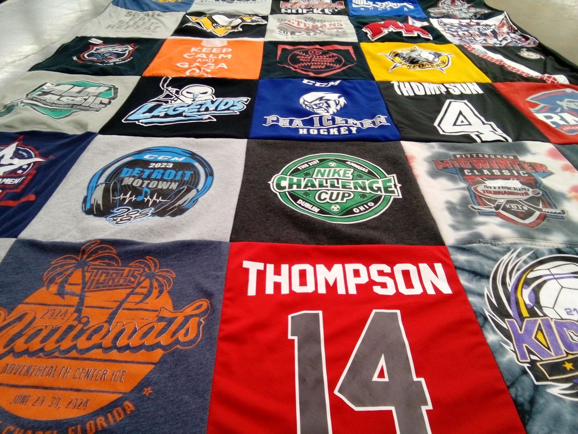 T-shirt quilt with hockey, sports themes by Venus from PA