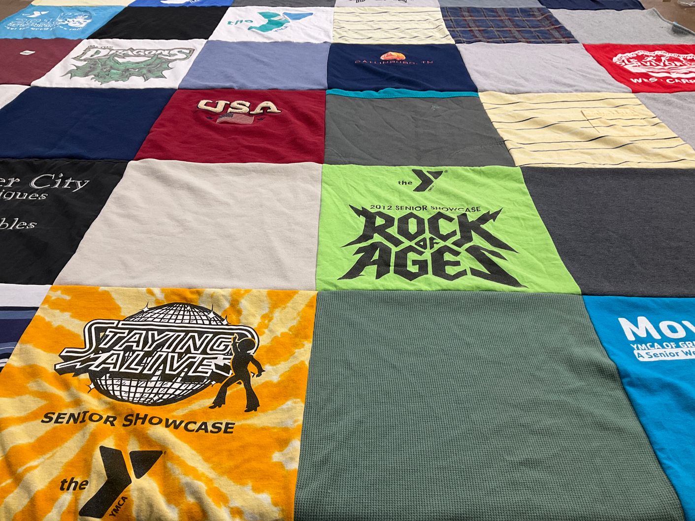 T-shirt quilt with performing arts, community service themes by Jay from GA