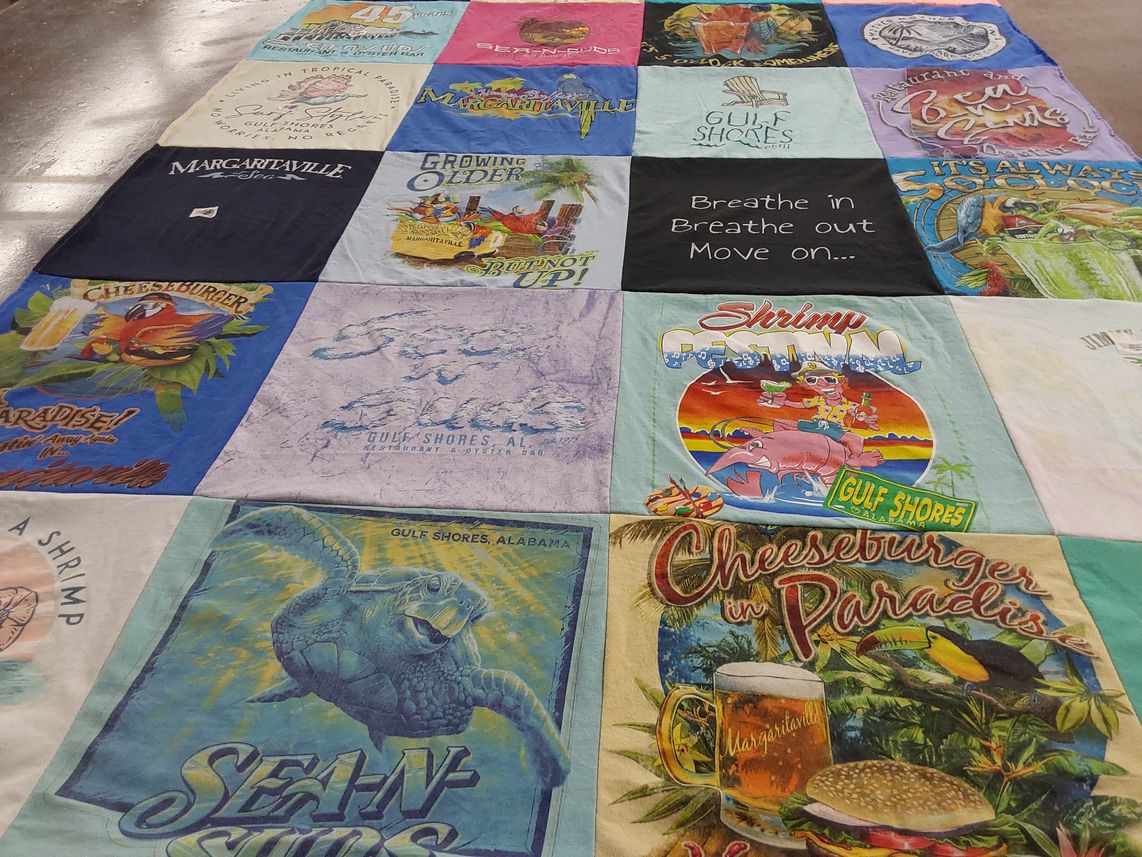 T-shirt quilt with beach, restaurants themes by Judy from IN