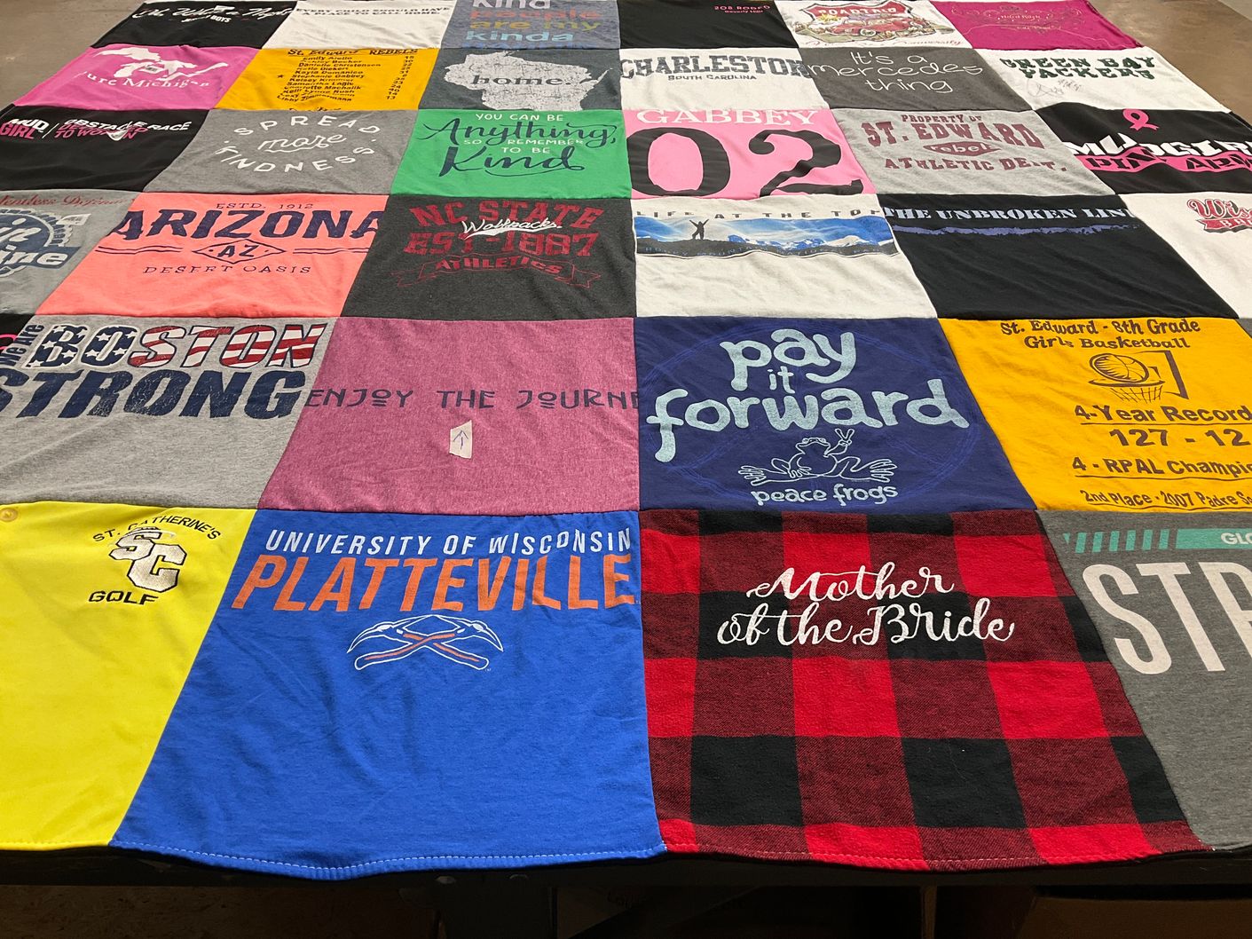 T-shirt quilt featuring nc state university, st. edward's school by Vicki from WI