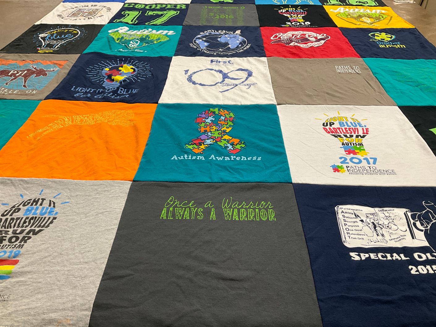 T-shirt quilt with autism awareness, community events themes by Jessica from OK