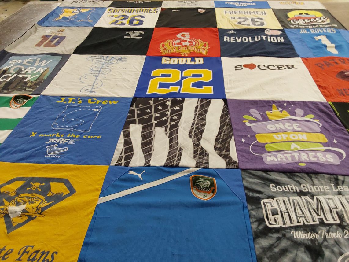 T-shirt quilt with theater, sports themes by Kendra from MA
