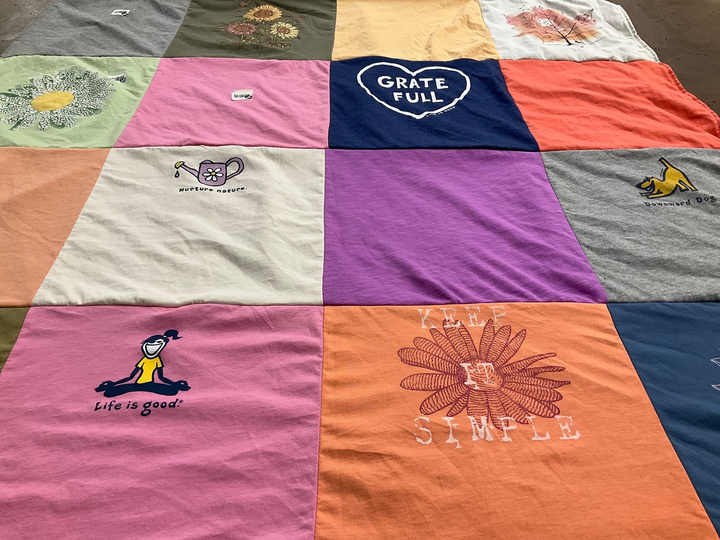 T-shirt quilt with gardening, yoga themes by LINDSAY from CA