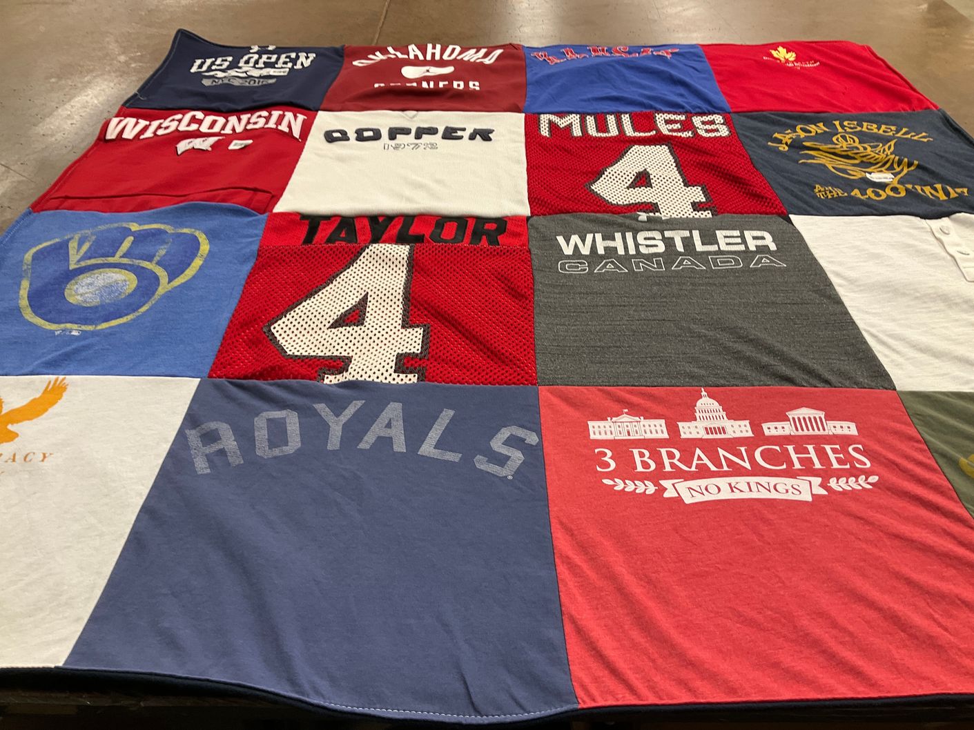 T-shirt quilt with sports, travel themes by Christine from WI