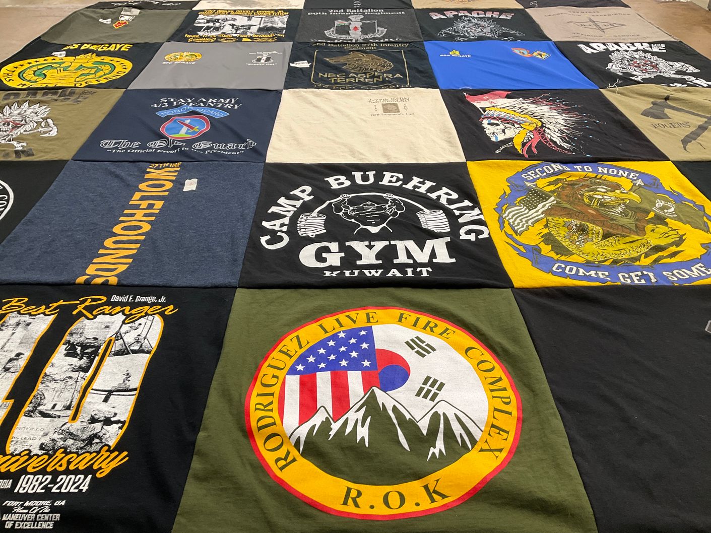 T-shirt quilt with military, fitness themes by Mychael from TX