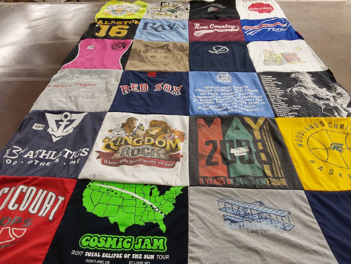T-shirt quilt with sports, music themes by Charlotte from TX