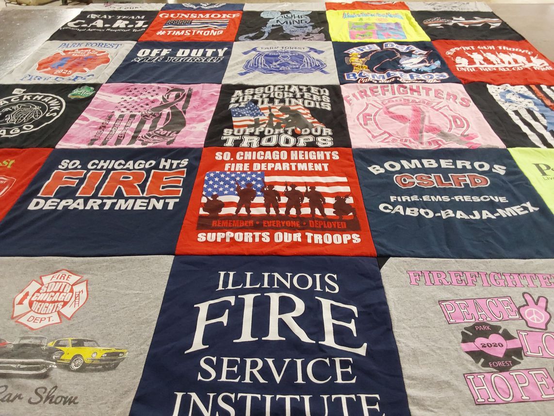 T-shirt quilt with firefighting, supporting troops themes by Julia from TN