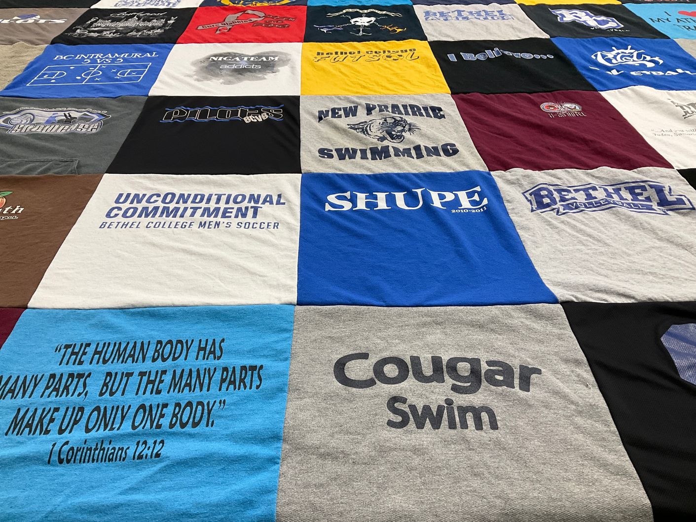 T-shirt quilt featuring bethel college men's soccer, new prairie swimming by Alicia from IN