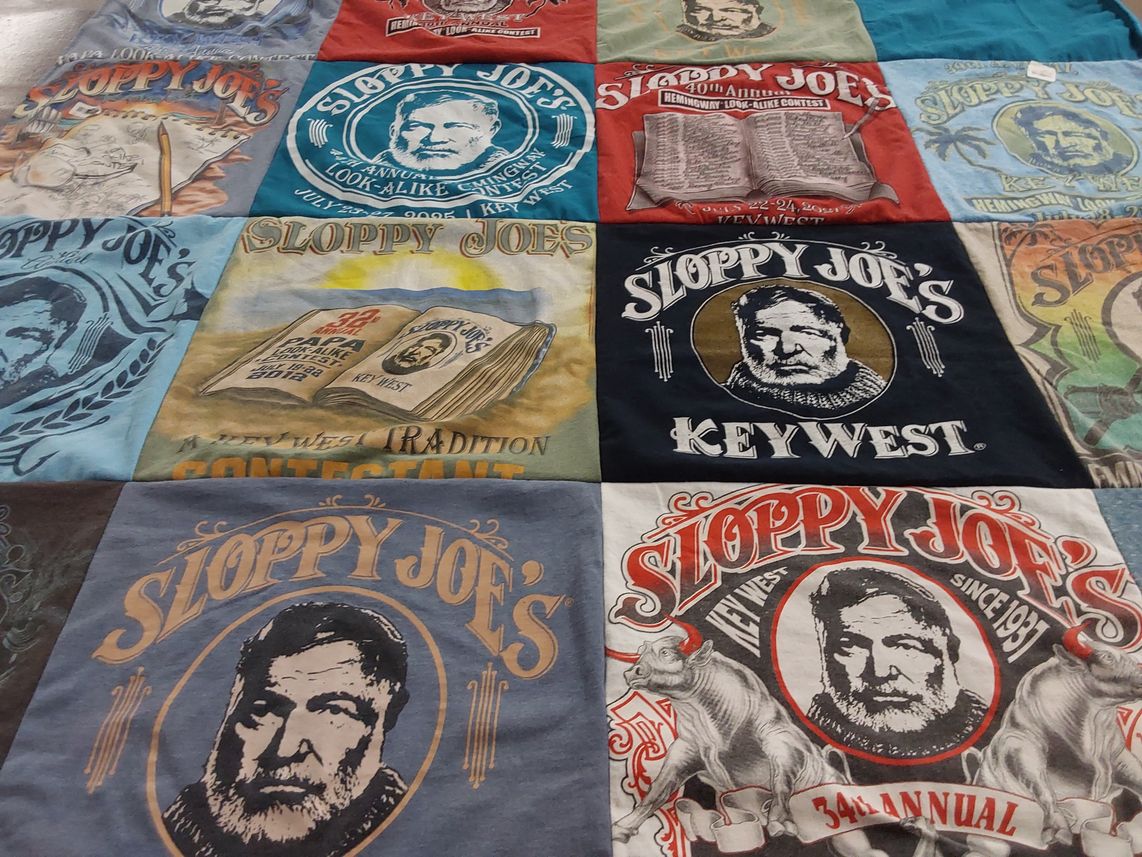 T-shirt quilt with literature, bar culture themes by Norman from NC