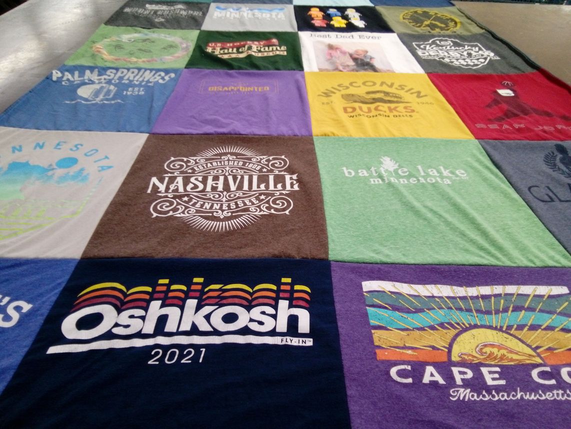 T-shirt quilt with travel, outdoor activities themes by Stephanie from MN