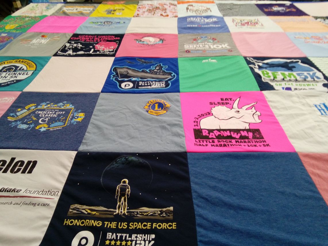 T-shirt quilt with running, space exploration themes by Helen from AL