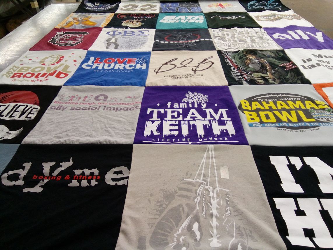 T-shirt quilt with community service, sports themes by Whitley from NC