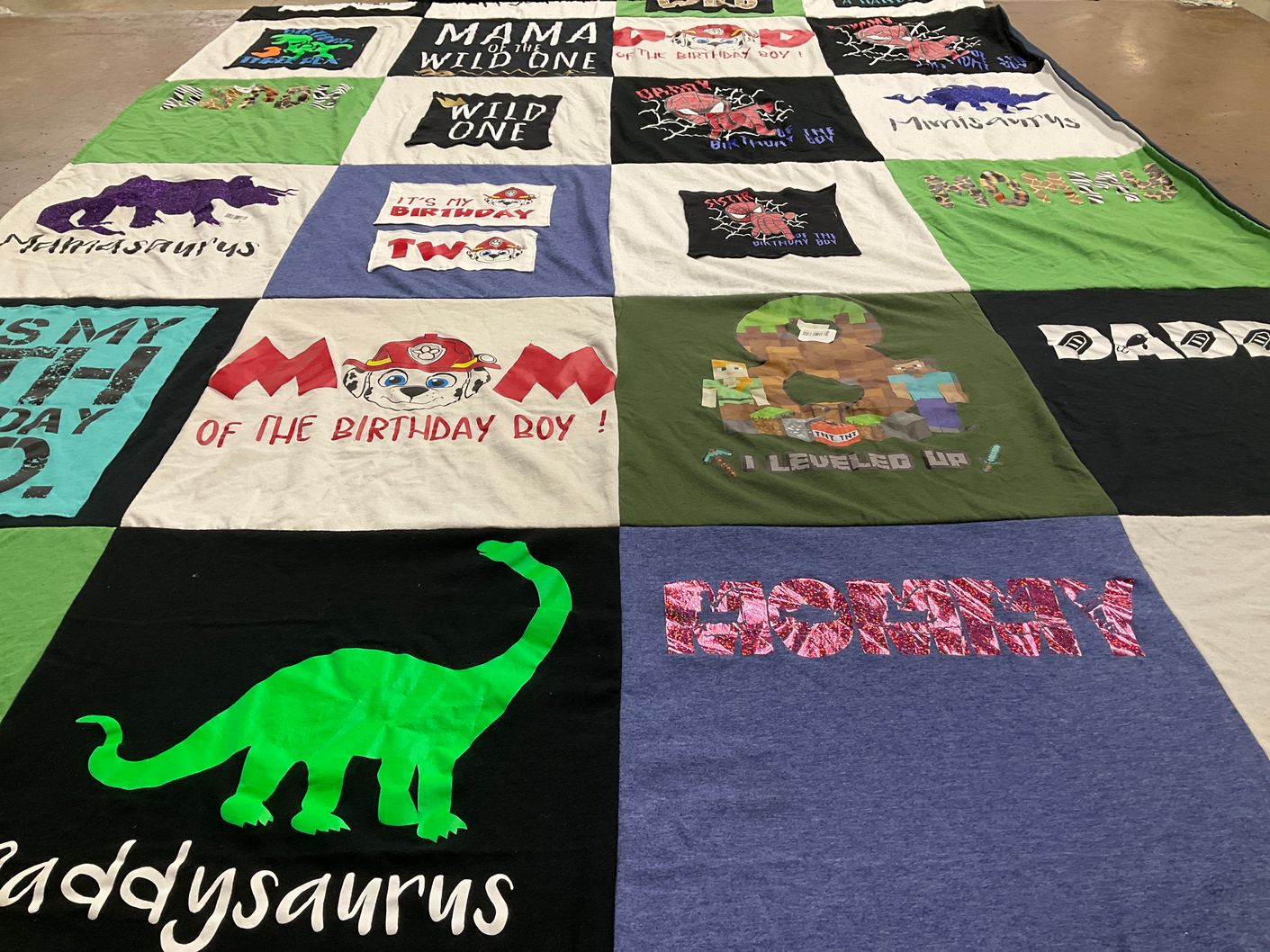 T-shirt quilt with dinosaurs, video games themes by Megan from TX