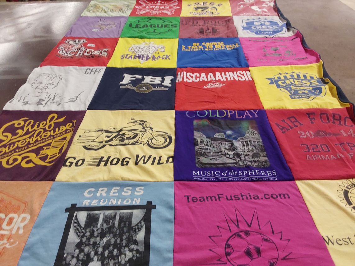 T-shirt quilt with music, sports themes by Mary from WI