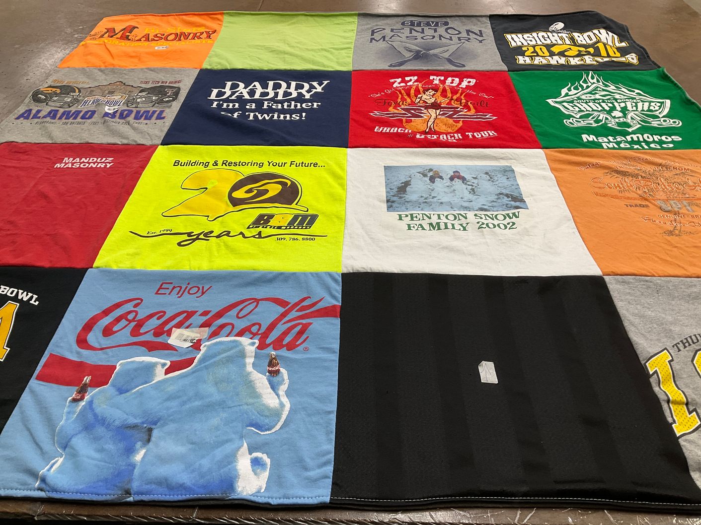 T-shirt quilt with masonry, family themes by Cathy from LA