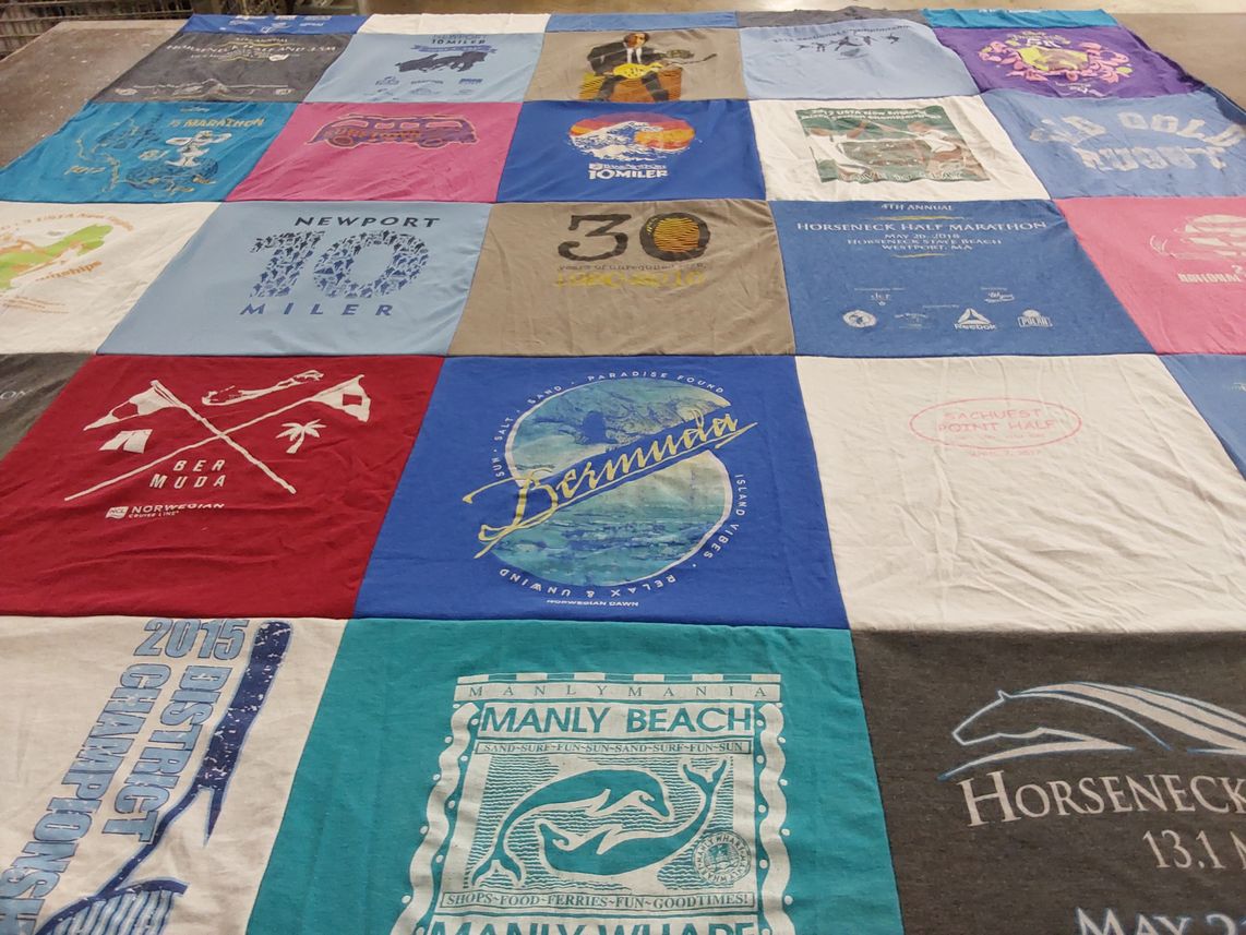 T-shirt quilt with running, travel themes by Theresa from MA