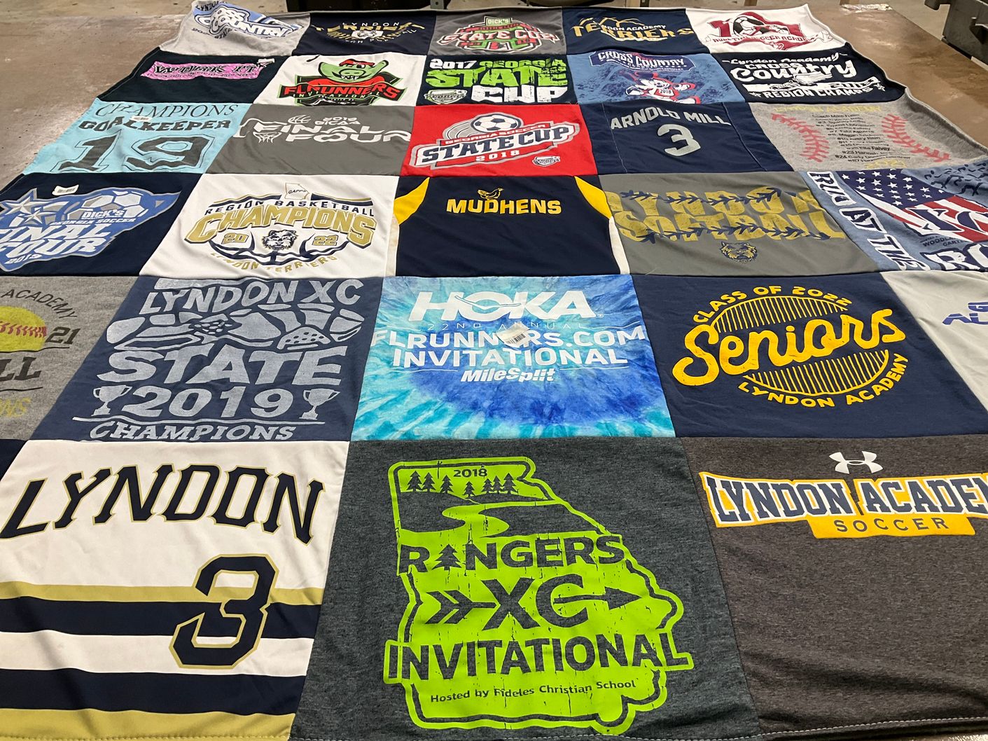T-shirt quilt featuring lyndon xc team by Laura from GA